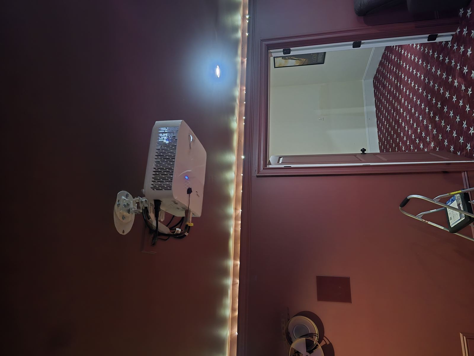 Home theater room with projector and movie poster