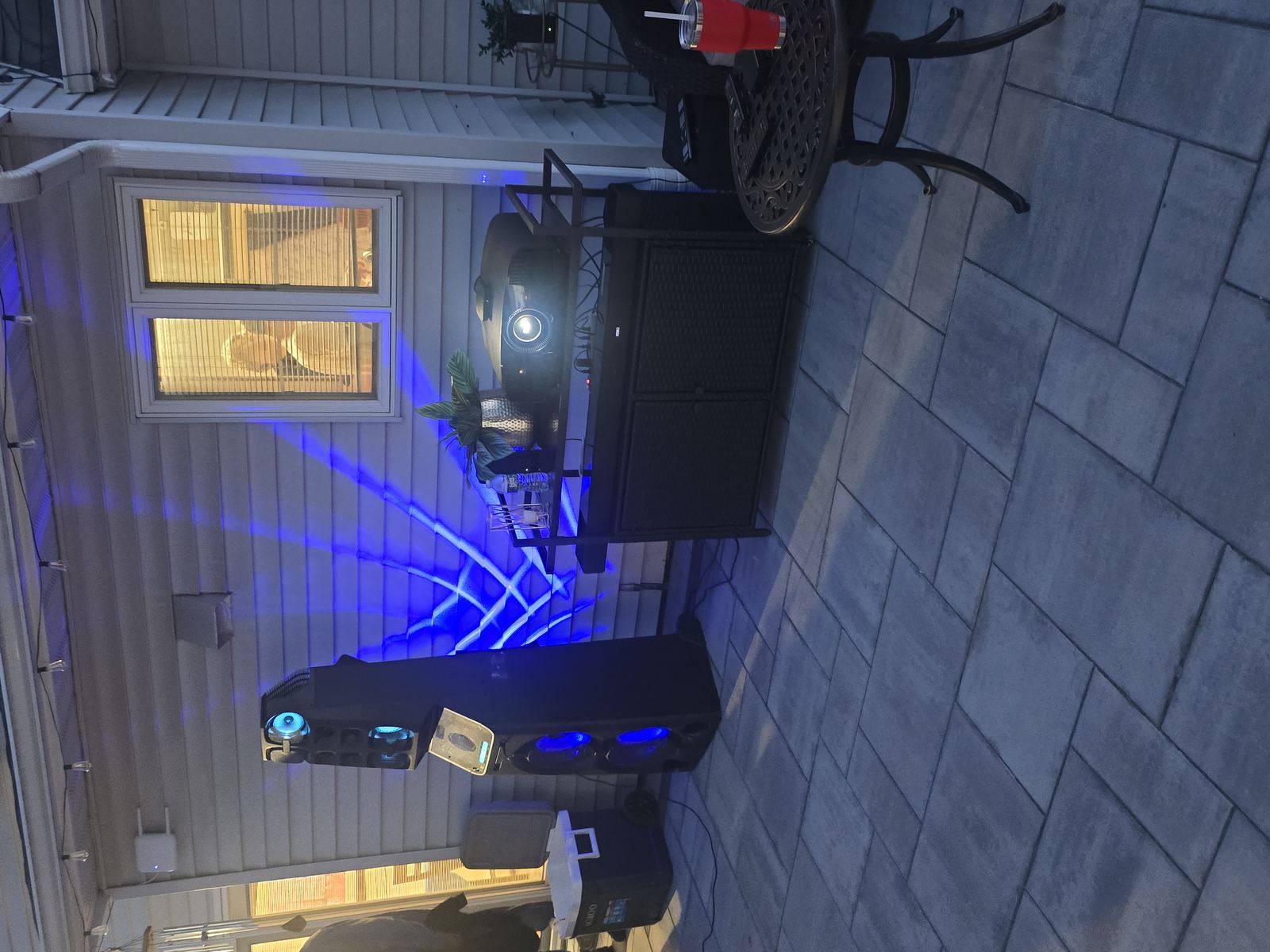 Tower speaker system set up on outdoor patio