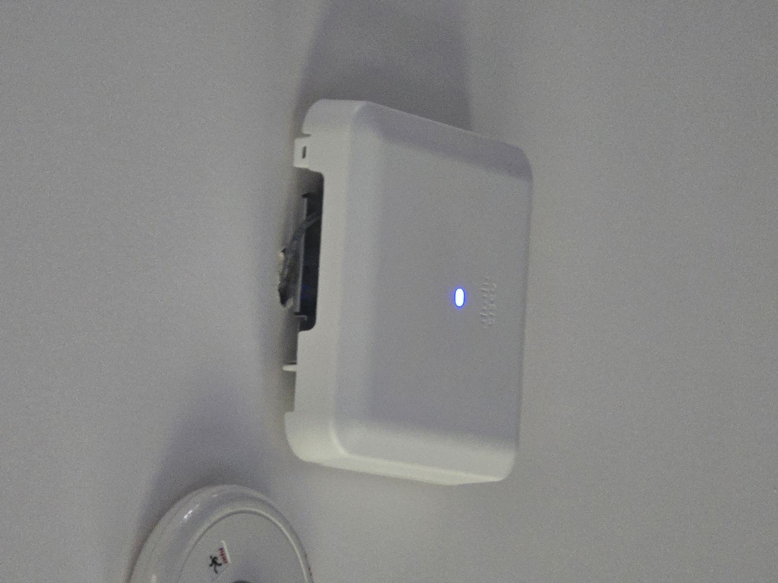 Wireless access point installed near ceiling corner